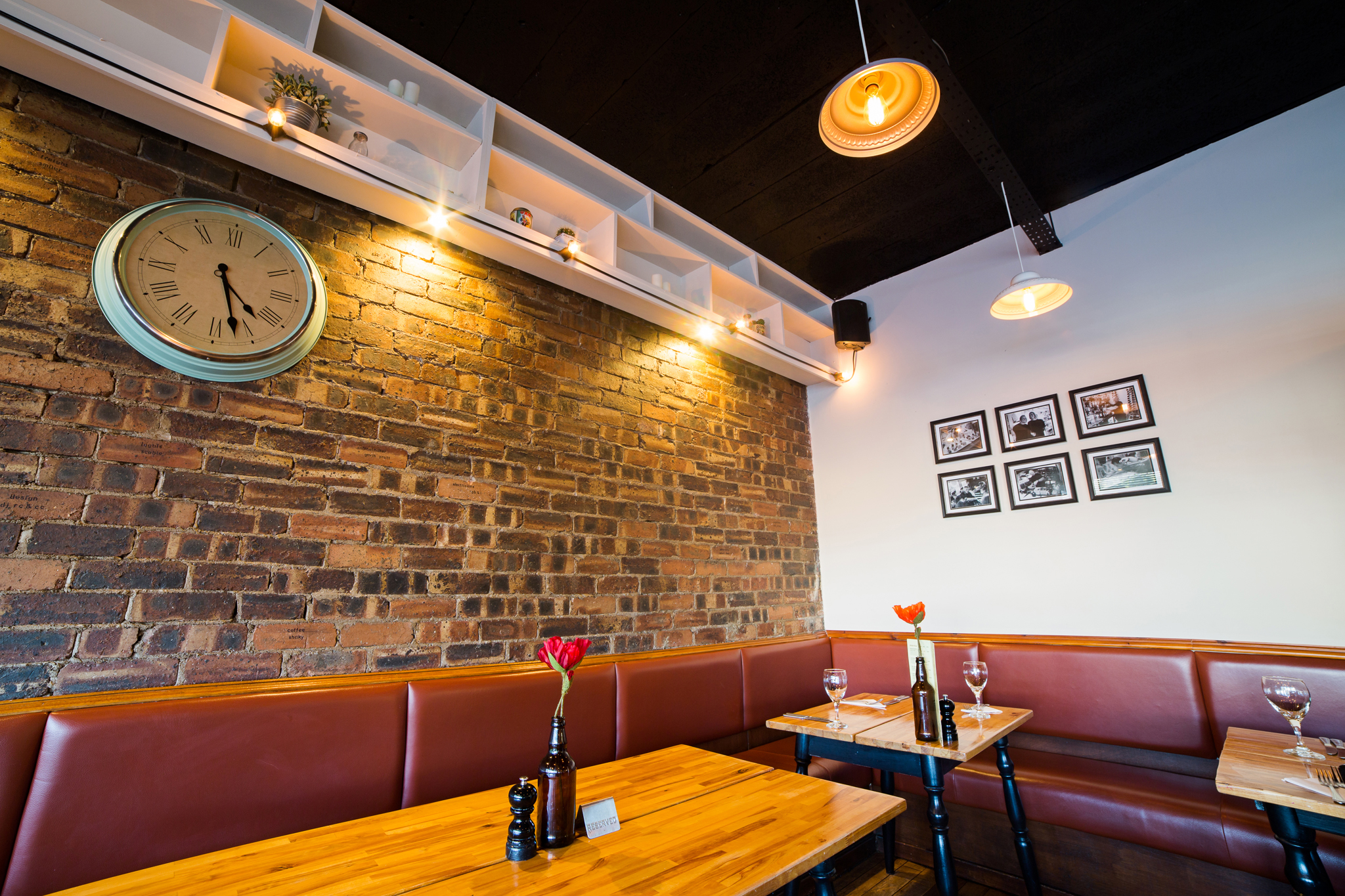 New interior features as sourced and arranged by Betty Bluebell - including feature wall with photography taken in-house by John Johnston Photography .