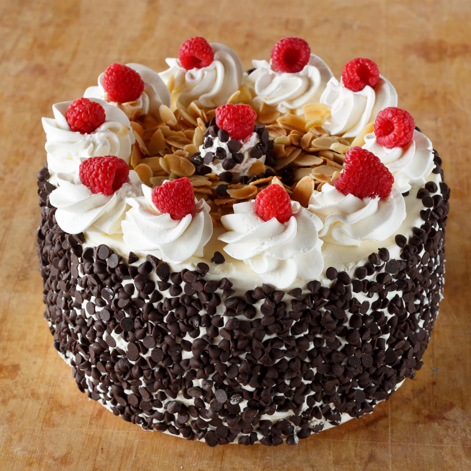 Fresh Raspberries and toasted walnuts on whip cream cake.jpg