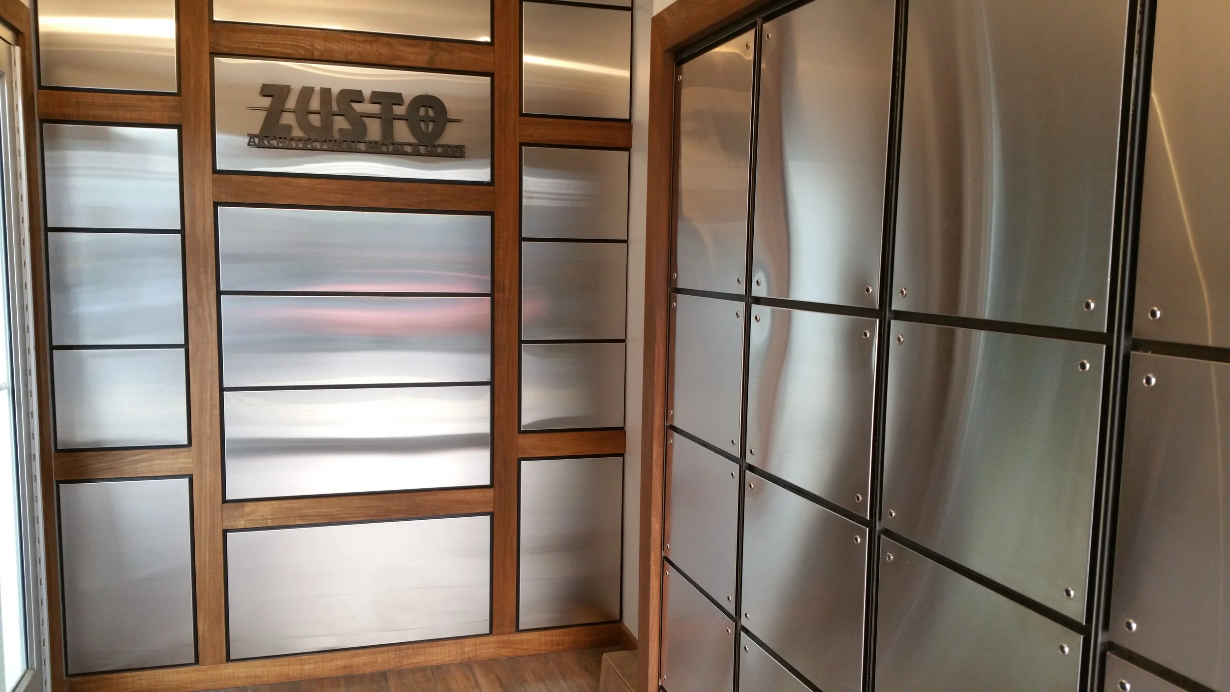 Our Own Entrance, Including Stainless Steel Panels, Blackened Steel Angle Surrounds, Plasma Cut Signage and some in-house woodwork