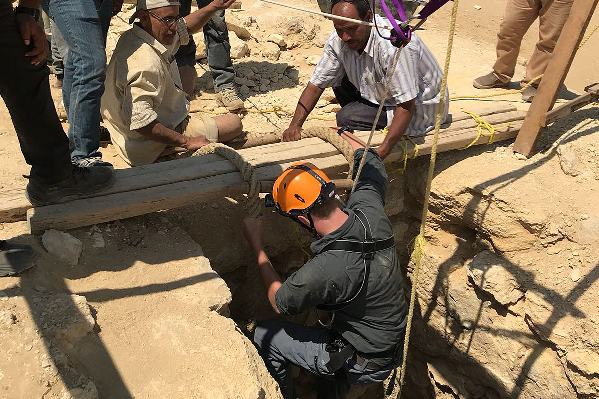 Descending a newly unearthed burial shaft at the Giza Pyramids