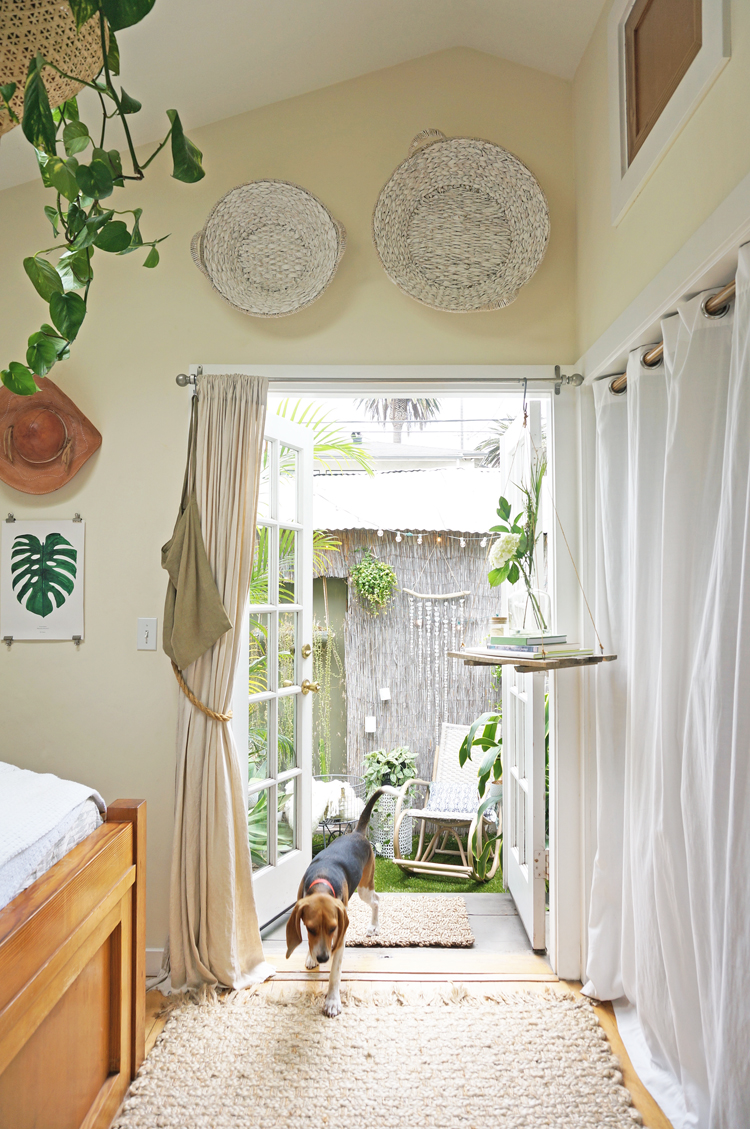 Sophee entering the bedroom from the garden stoop. our closet, on the right, will soon be redone as the nursery.