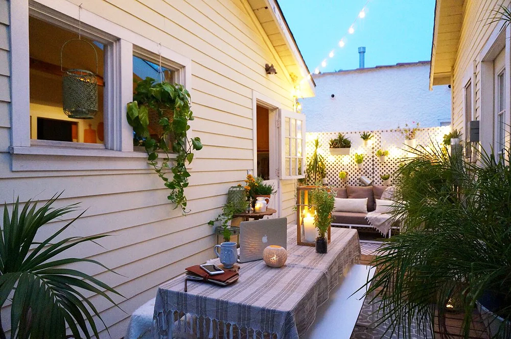 "AFTER" - The porch between the cottages. We had it set up this way for years in order to accommodate dinner guests or host happy hours.
