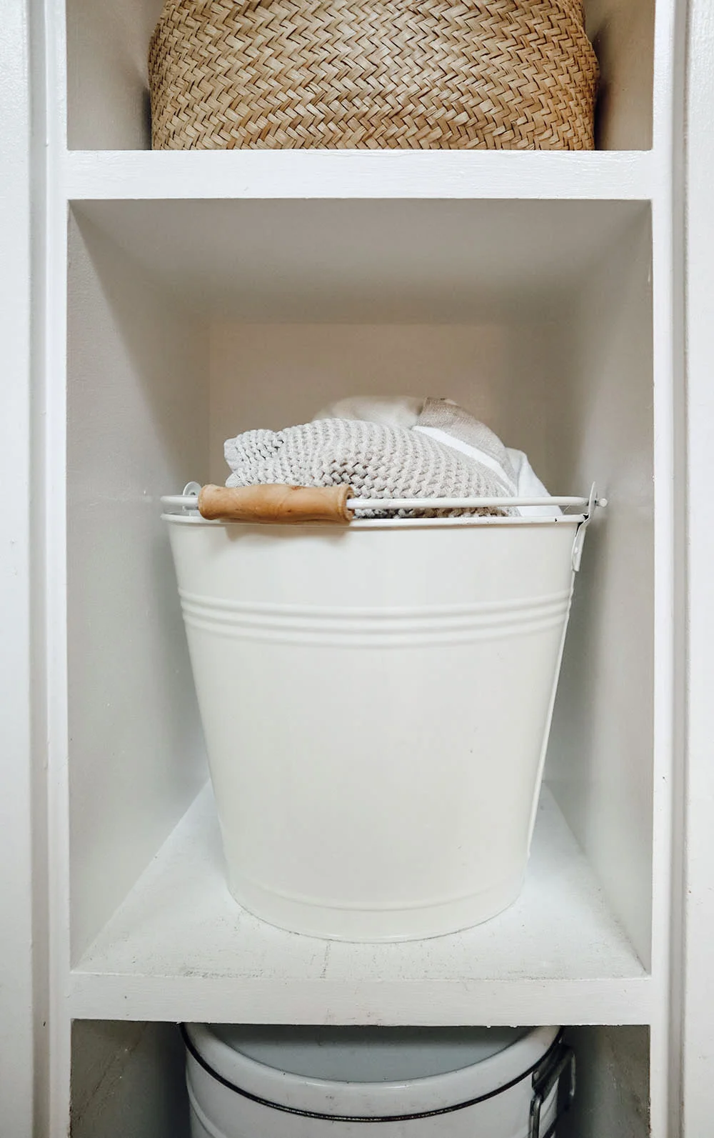 Above: A mop bucket holds all of our spare towels for the beach, guests, and more. The pail itself becomes a toy for West when we visit our local beach.