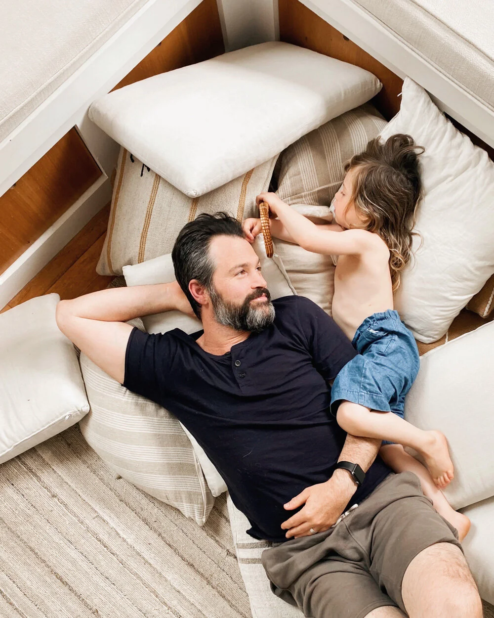 Above:  Adam Winkleman  and West enjoying the remains of what was once an epic pillow fort.