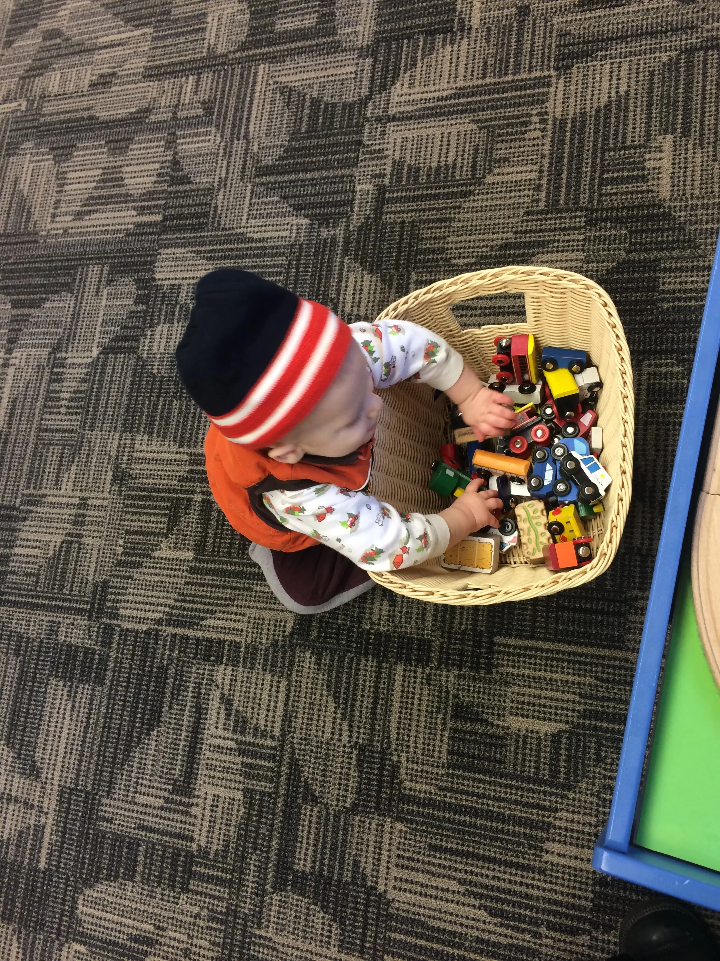At the Library - Trying to capture the cuteness of my little guy playing with trains
