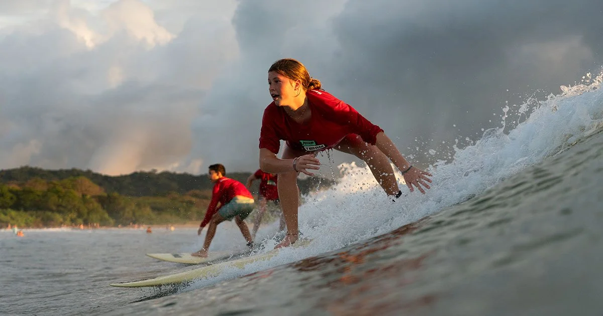 A group of teens surfing during Discover Term