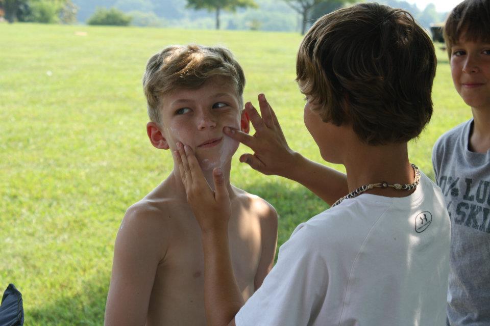Nate getting sunscreen-ed up on Memorial Day 2012.
