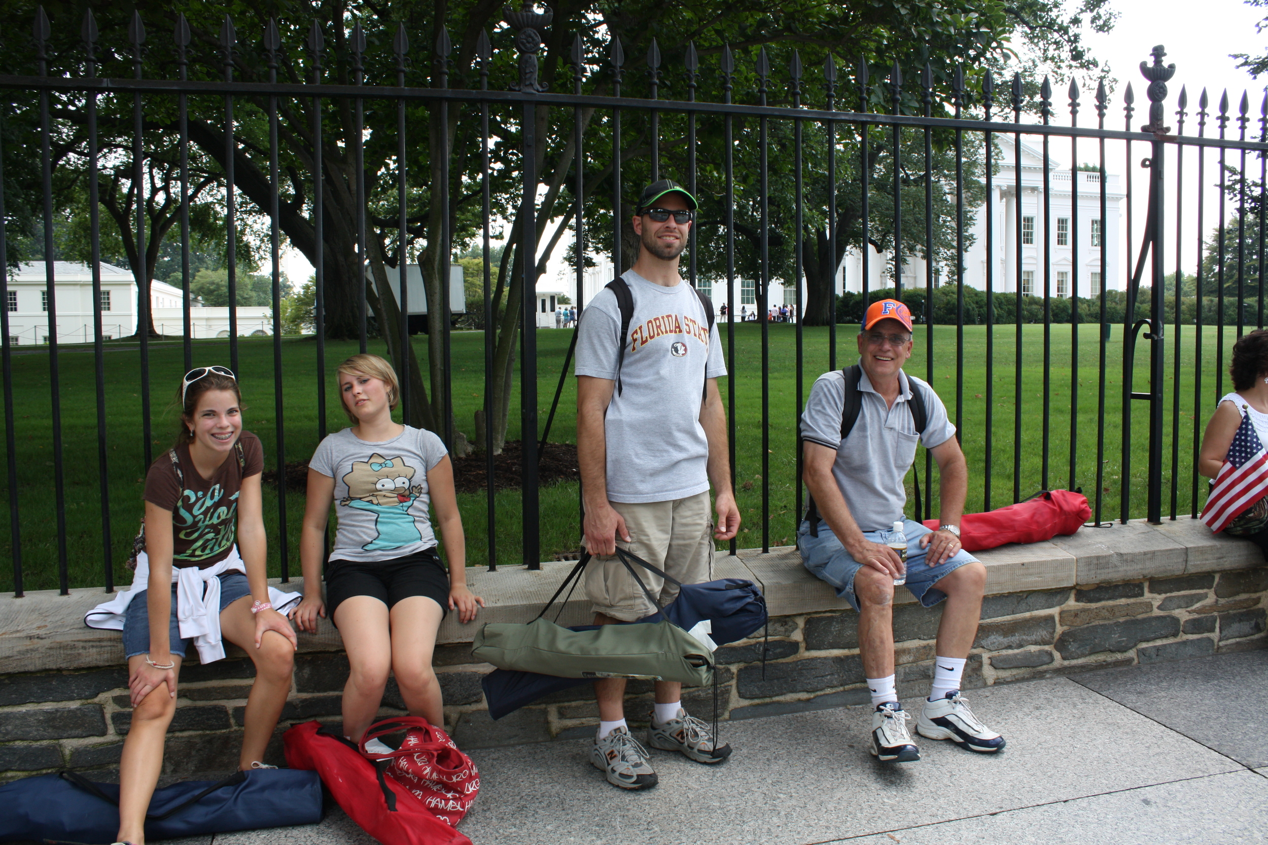 THE TIRED BUNCH WITH THEIR CHAIRS AND BACKPACKS