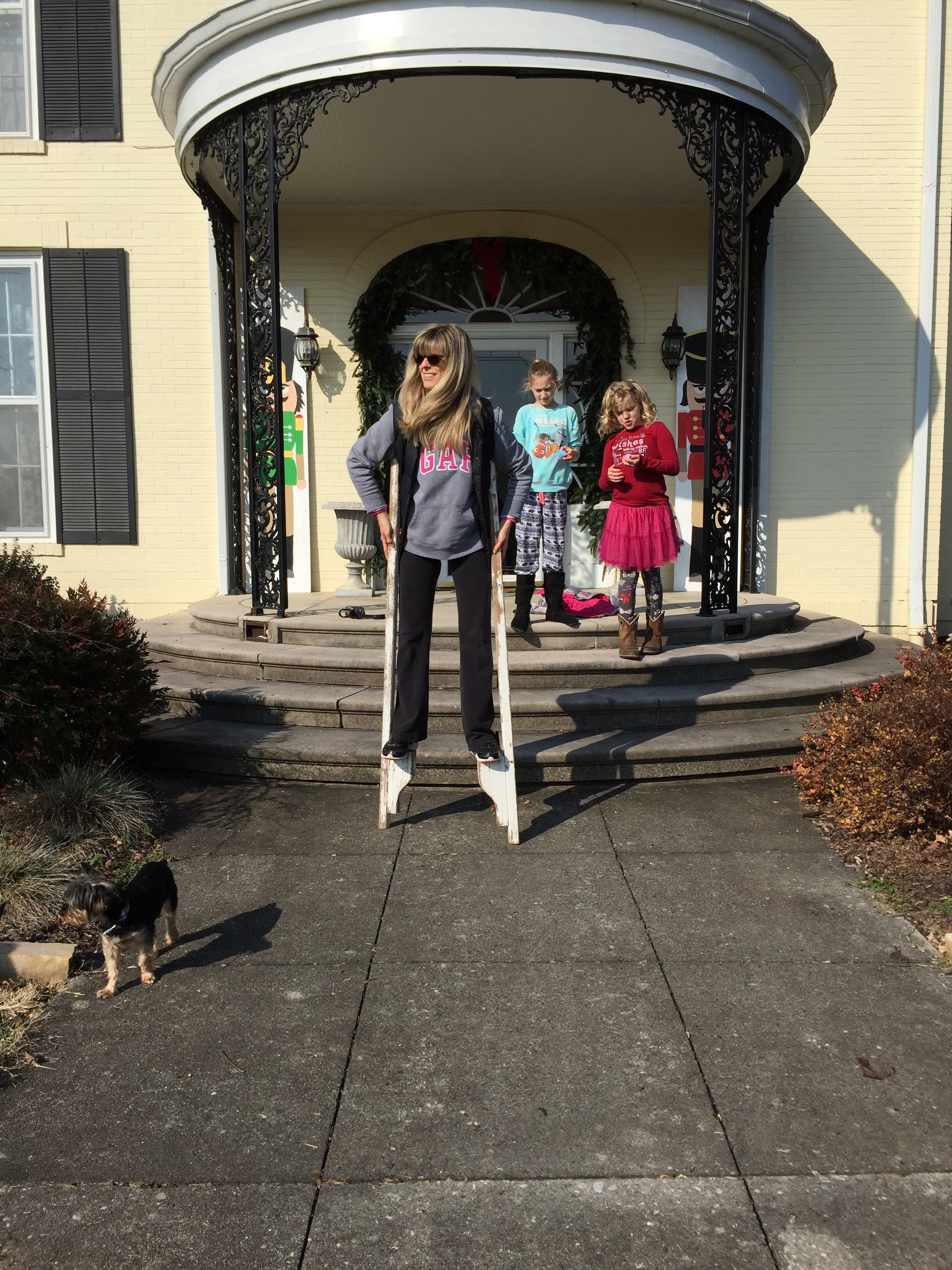 TEACHING THE KIDS HOW TO WALK ON STILTS