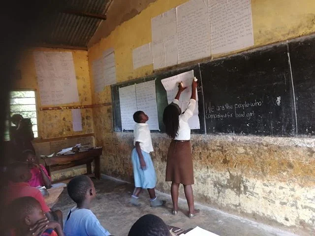 @teachforuganda Teacher- Molly showing the way to our kids. At Kasiiso C/U Primary School. When TFU fellows arrived in this community our children were 2 years behind on all aspects of their reading/writing, comprehension and arithmetic. Their confidence levels were almost zero. It’s almost day and night hearing and witnessing the transformation in just 10 months of having TFU fellows as their teachers! Grateful to our partners, board and champions and supporters of TFU