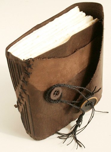   handmade, hand-bound leather journal. long stitch bound.  