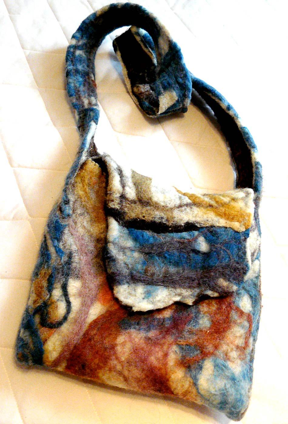   wet/needle felted bag, with needle felted pocket and cotton lining.  