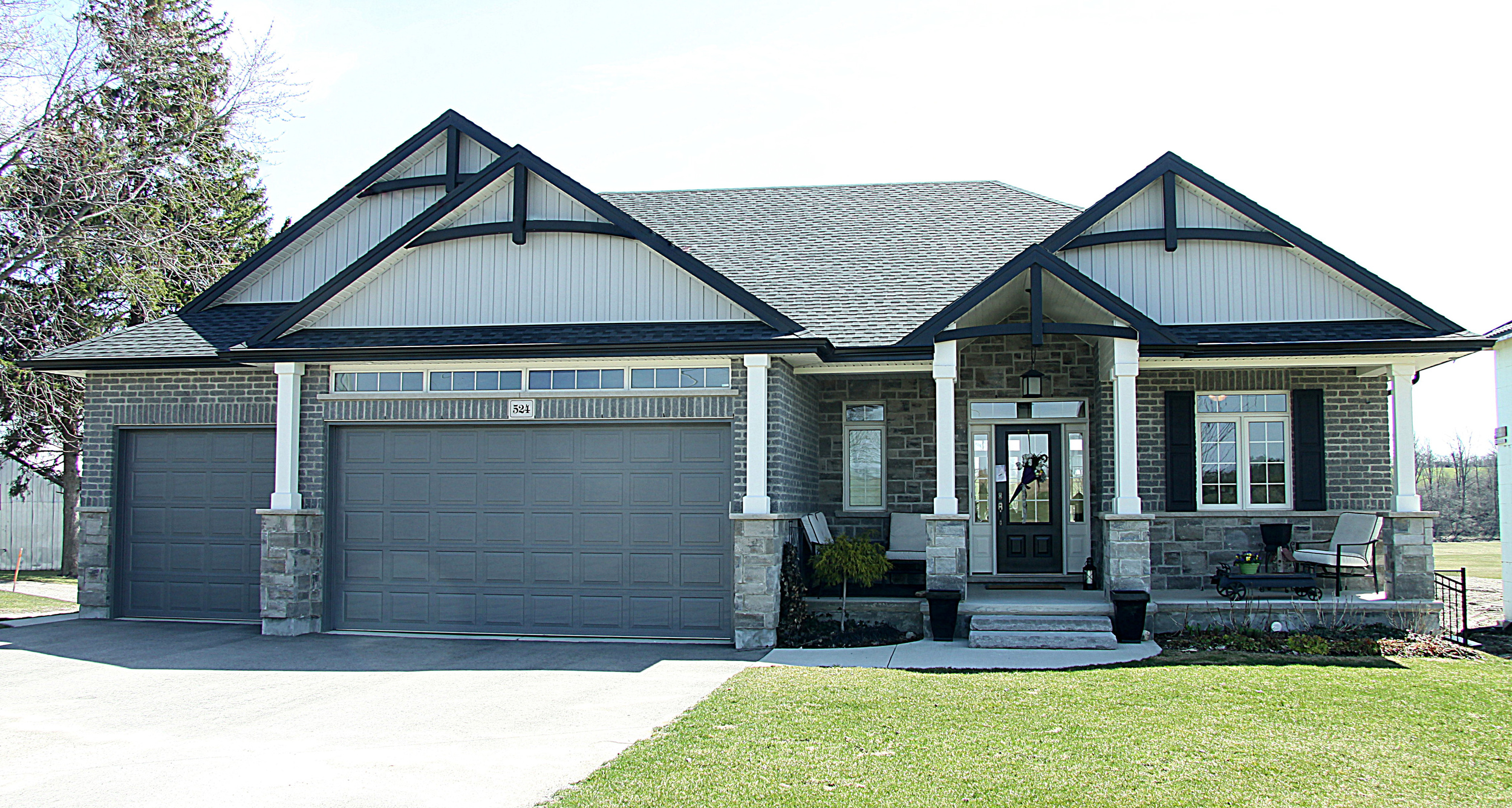 New Home Exterior Stone with Brick Gable accents