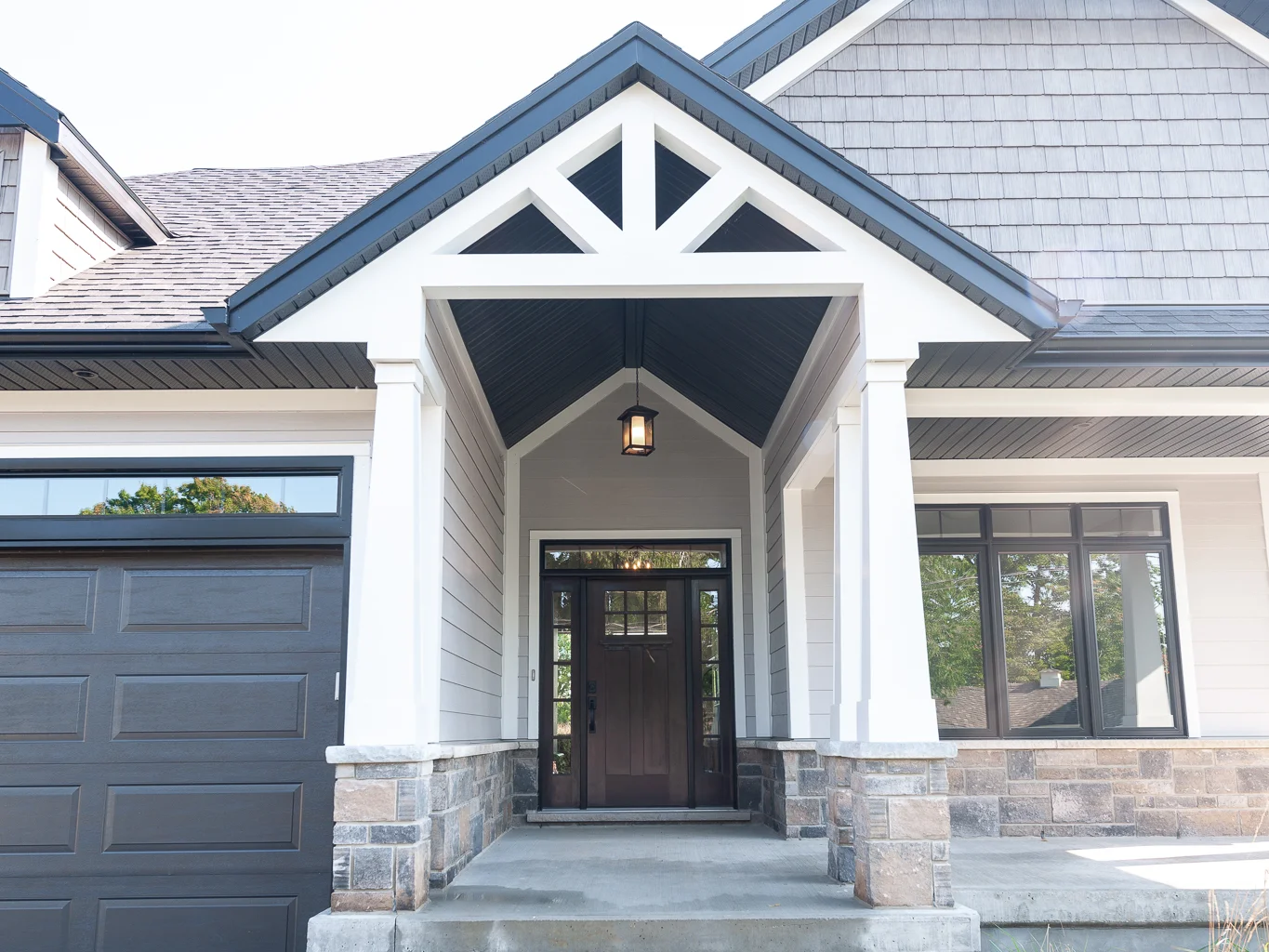 Exterior front entry Stone Columns and James Hardie siding