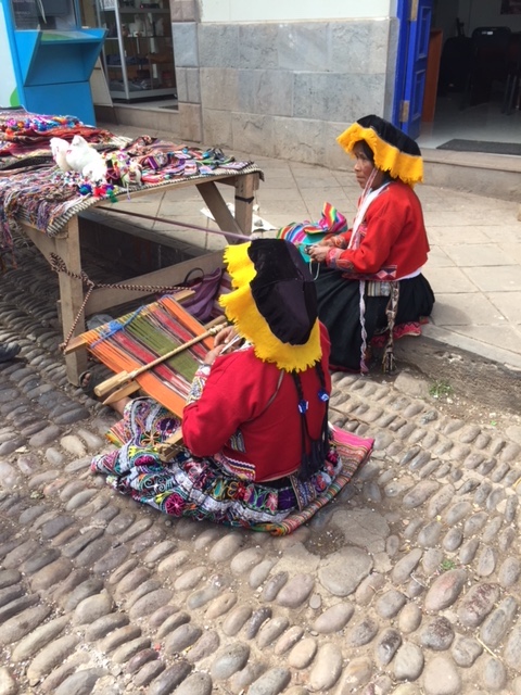 Weavers in Pisac. Clothing is similar to what was worn hundreds of years ago and unique to each tribe.