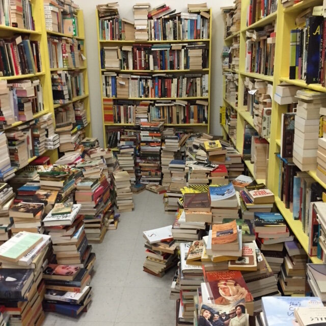 A jumble of books at a used book store sometimes looks like my brain trying to assimilate my books.