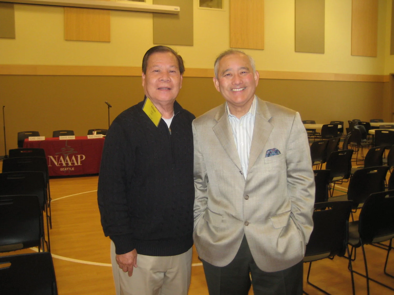 Above: In 2013, EDI hosted a Leadership Together Conference at ACRS, inviting other organizations like NAAAP-Seattle. The 'brothers' Chan and Al pose for a photo at the event.