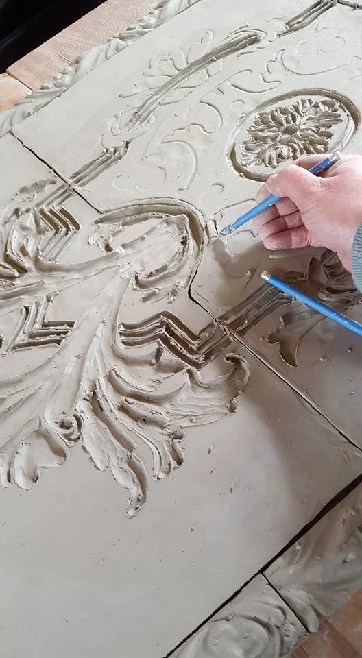 Carving the design is long and careful process.