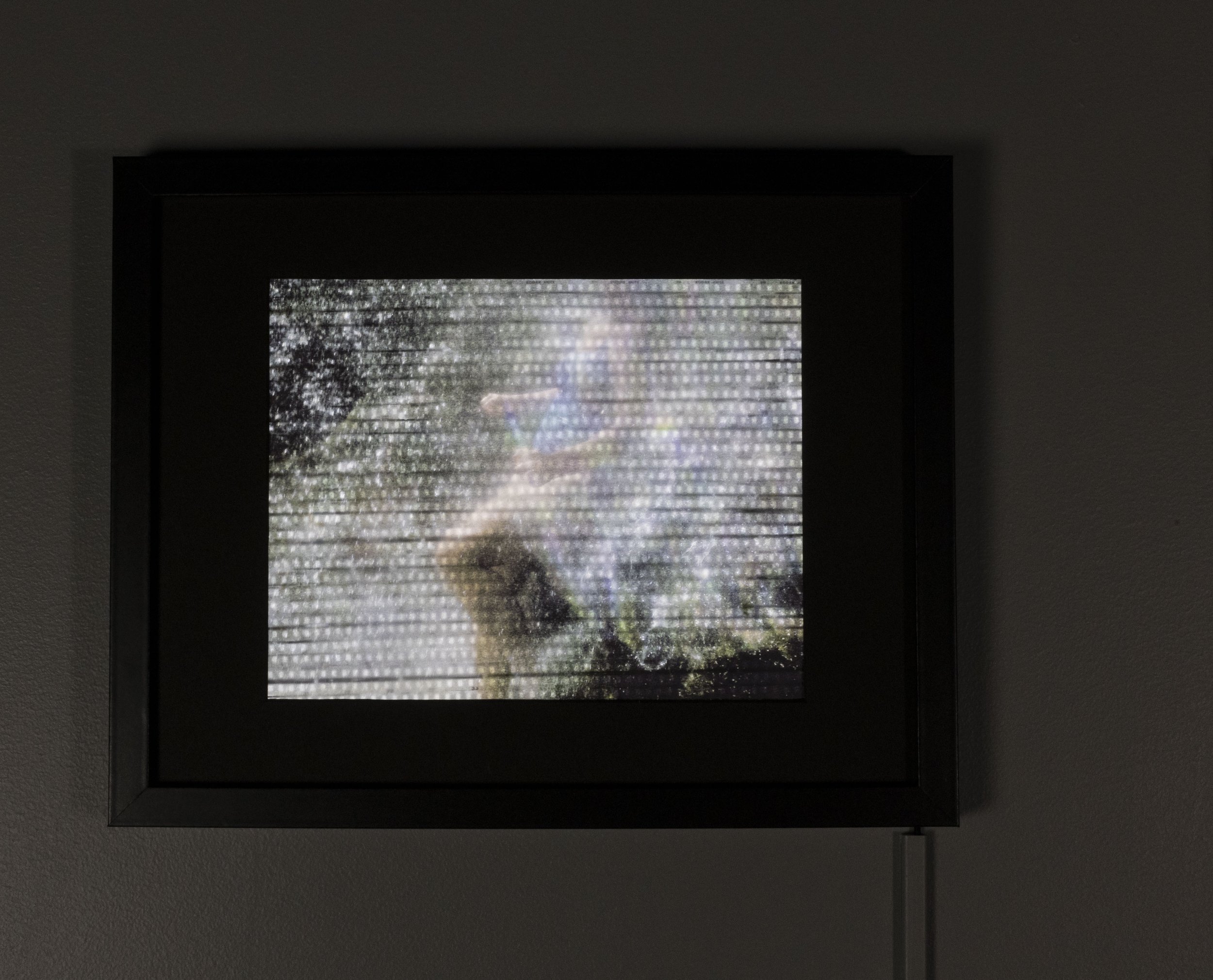 Separation. Giclée print on vellum, 35mm negatives, LEDs, wood