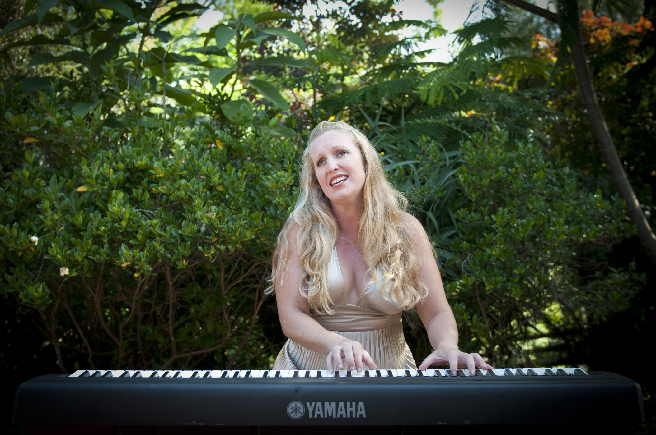 Singing and playing for a garden wedding