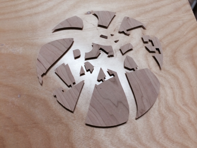 The basketball is cut from cherry, and glued in place.