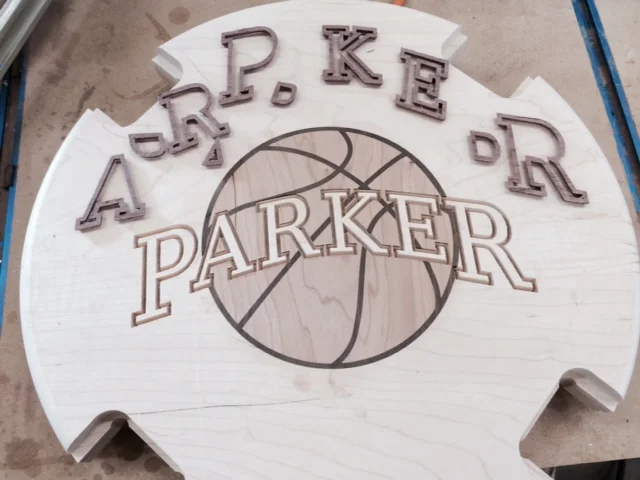 Purpleheart is used to outline the letters, giving them nice contrast.