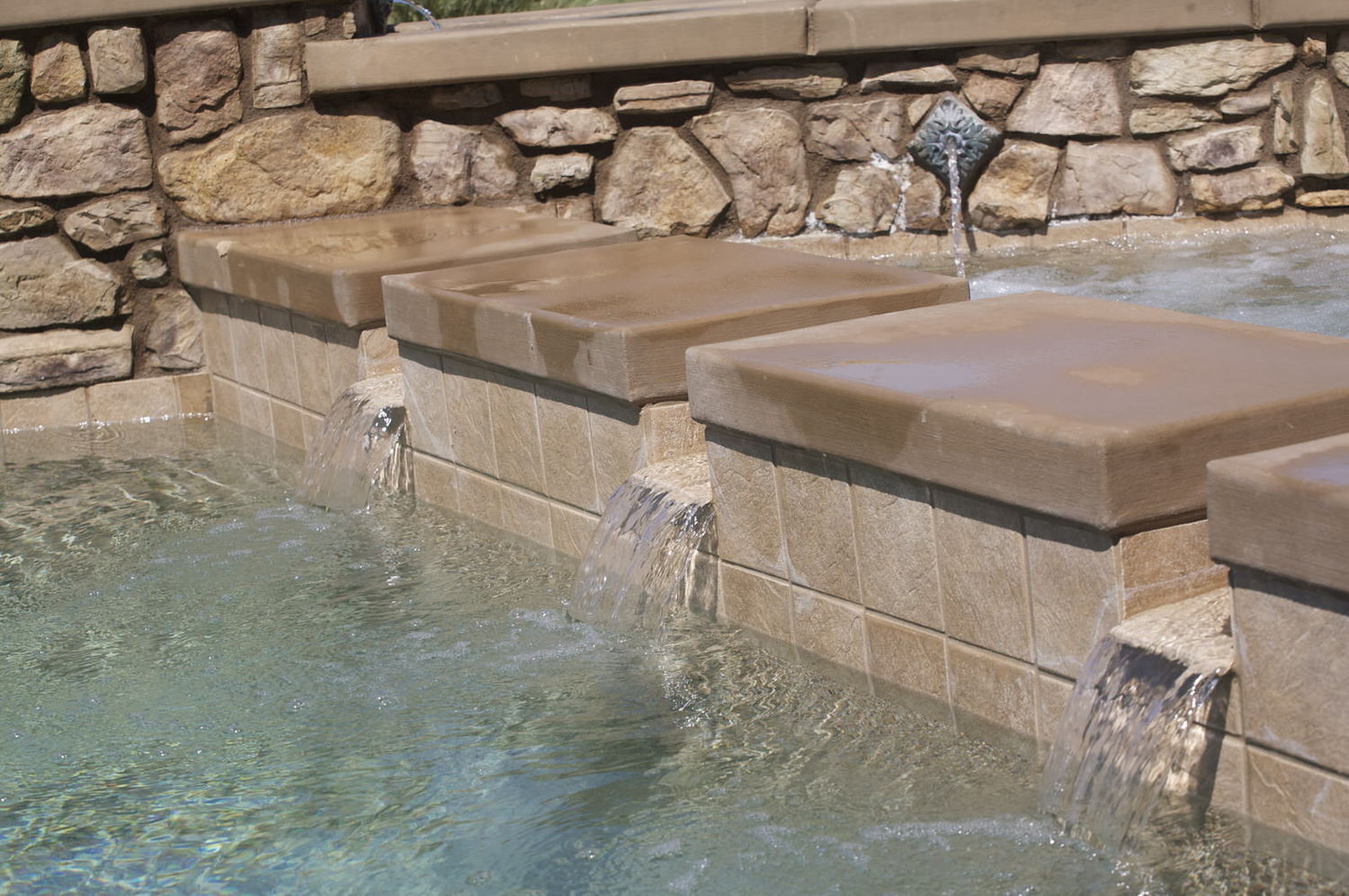 Spillways - are decorative released of flows from a raised spa into a downstream area, typically a pool.