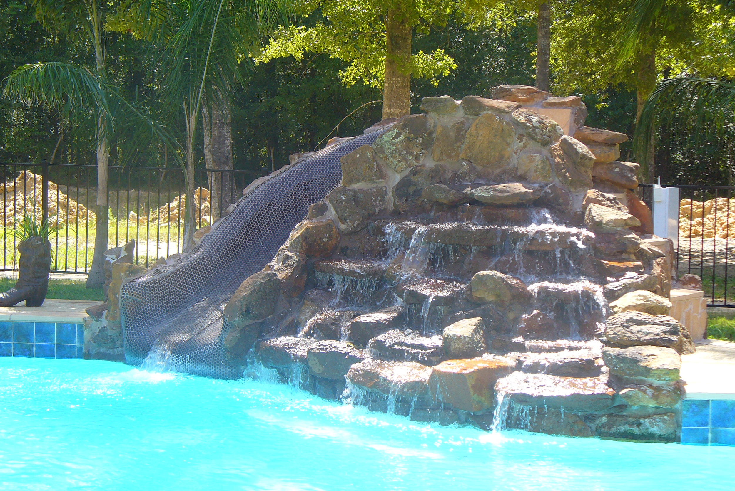 Rock Waterfall with Slide - This practical feature provides the most relaxing sound effects while providing stunning looks. They range by weight from two tons on up.