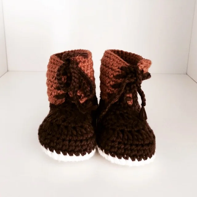 knit baby bean boots, now displayed in the nursery