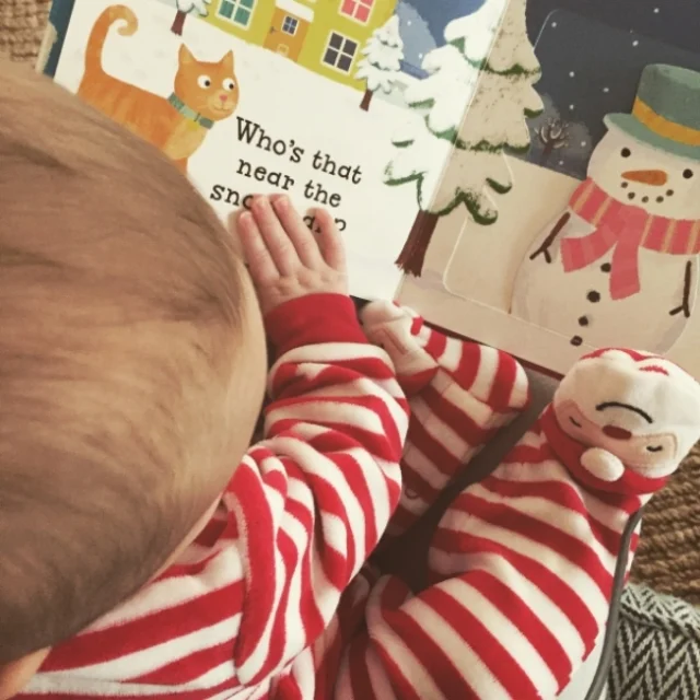 {First Christmas book • Peek-a-boo, of course • Gifting a holiday book to read by the tree will definitely become a tradition} 