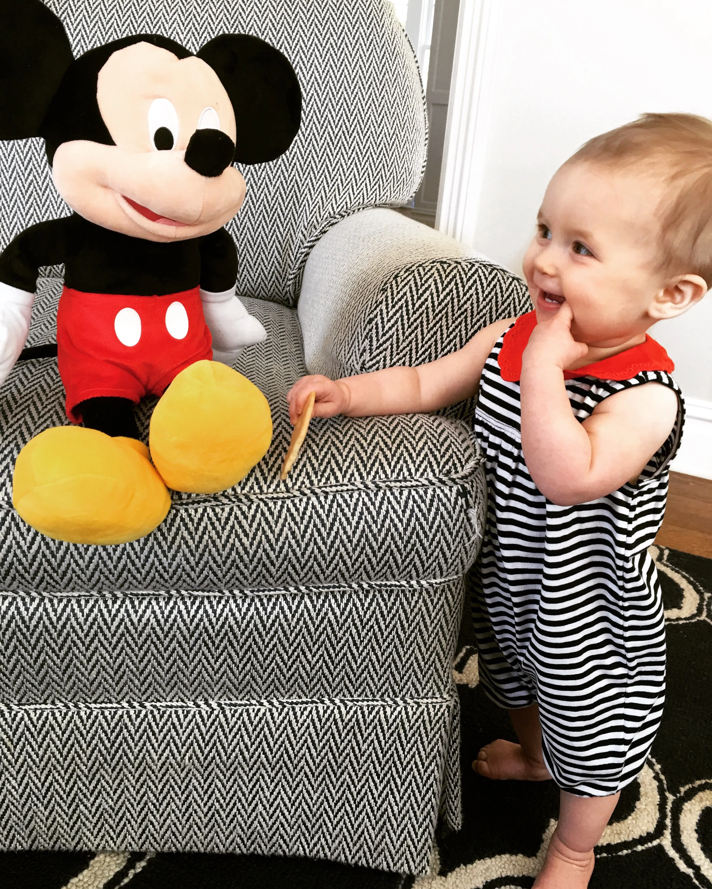 This little eleven month old + her pal, Mickey