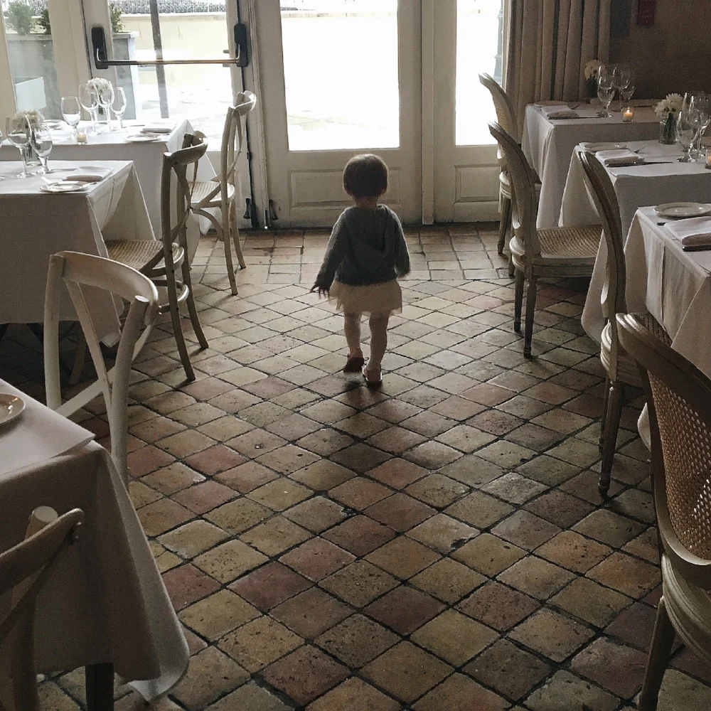 {A tutu-clad girl at one of our favorite local restaurants, L'Escale}