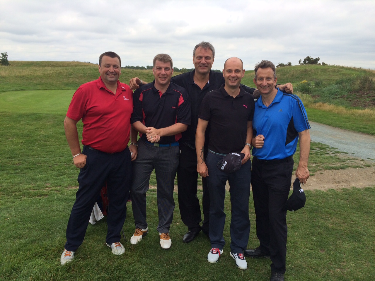 A very happy team with here pictured with Lance Haggith (centre) founder of Sports Traider UK and Golf Aid UK.