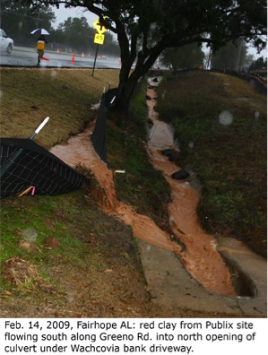 Runoff filled with sediment rushes over insufficient silt fences at a problem site in Fairhope, Al