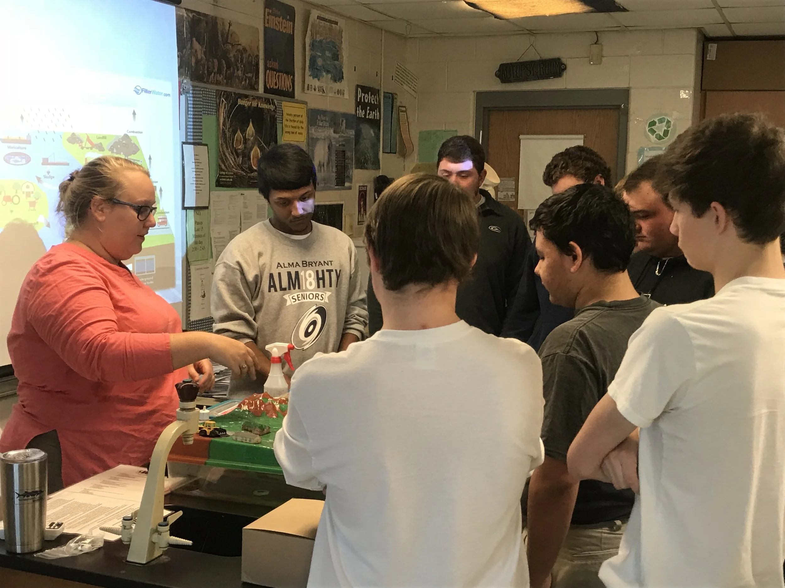Local students from Alma Bryant High School learn about watersheds through the water table demonstration. 