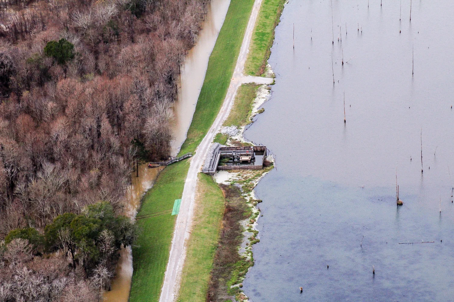 Plant Barry’s coal ash pond borders the Mobile River in Bucks, AL. Photo: Cade Kistler - Mobile Baykeeper