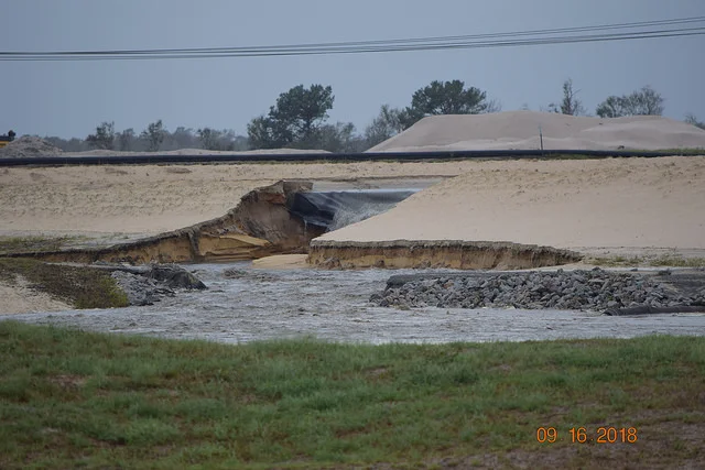 Coal ash pours out of Duke Energy’s L.V. Sutton ash pond in North Carolina. Photo: Kemp Burdette - Cape Fear Riverkeeper