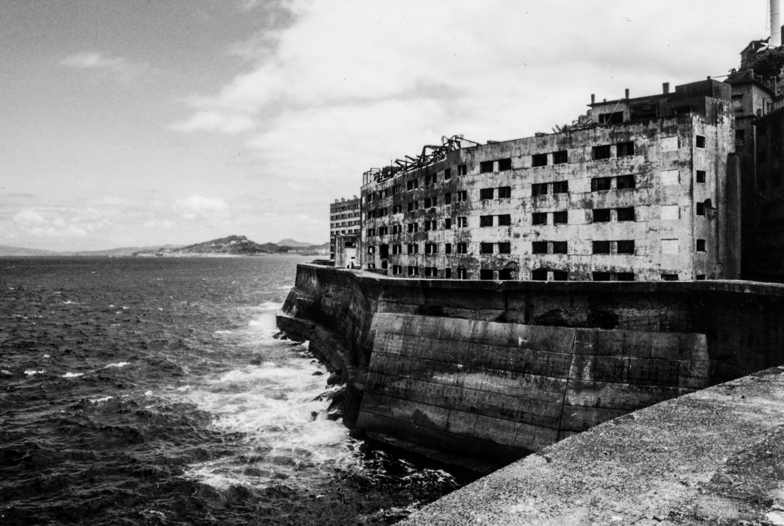   HASHIMA&nbsp;ISLAND, JAPAN   2001    Mid-century Japanese history never spoke much about Gunkanjima Island, an abandoned outpost 15km off the coast of Nagasaki.     Established in 1887 as a treasure for coal mining manufacturing, the 15-acre island