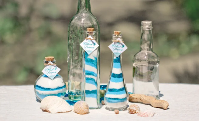 In this figure, dark blue, light blue and white are mixed. You can put them into different bottle shapes or style. These are best for table decoration for an event like beach wedding. It is also perfect for tables in your gardens and inside your home. It's cheaper, natural and more unique than to buy expensive ornament.