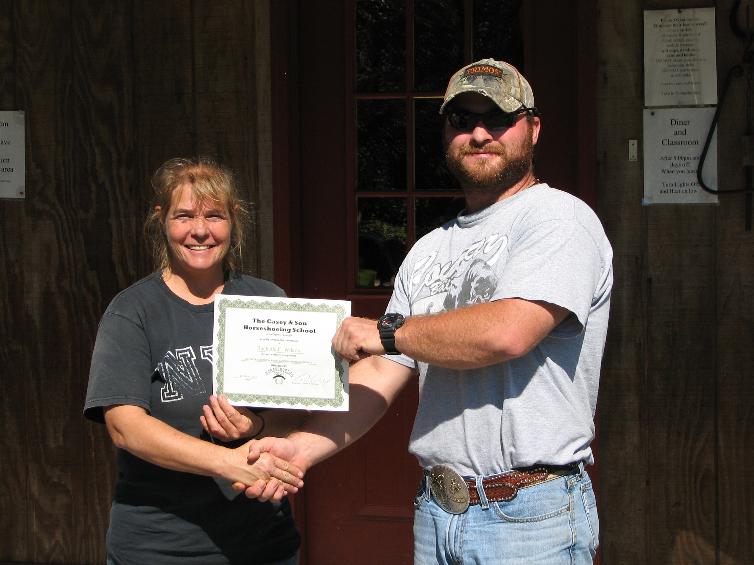 Rachelle Wilcox on graduation day with Link, owner/instructor at Georgia Horseshoeing School 2013