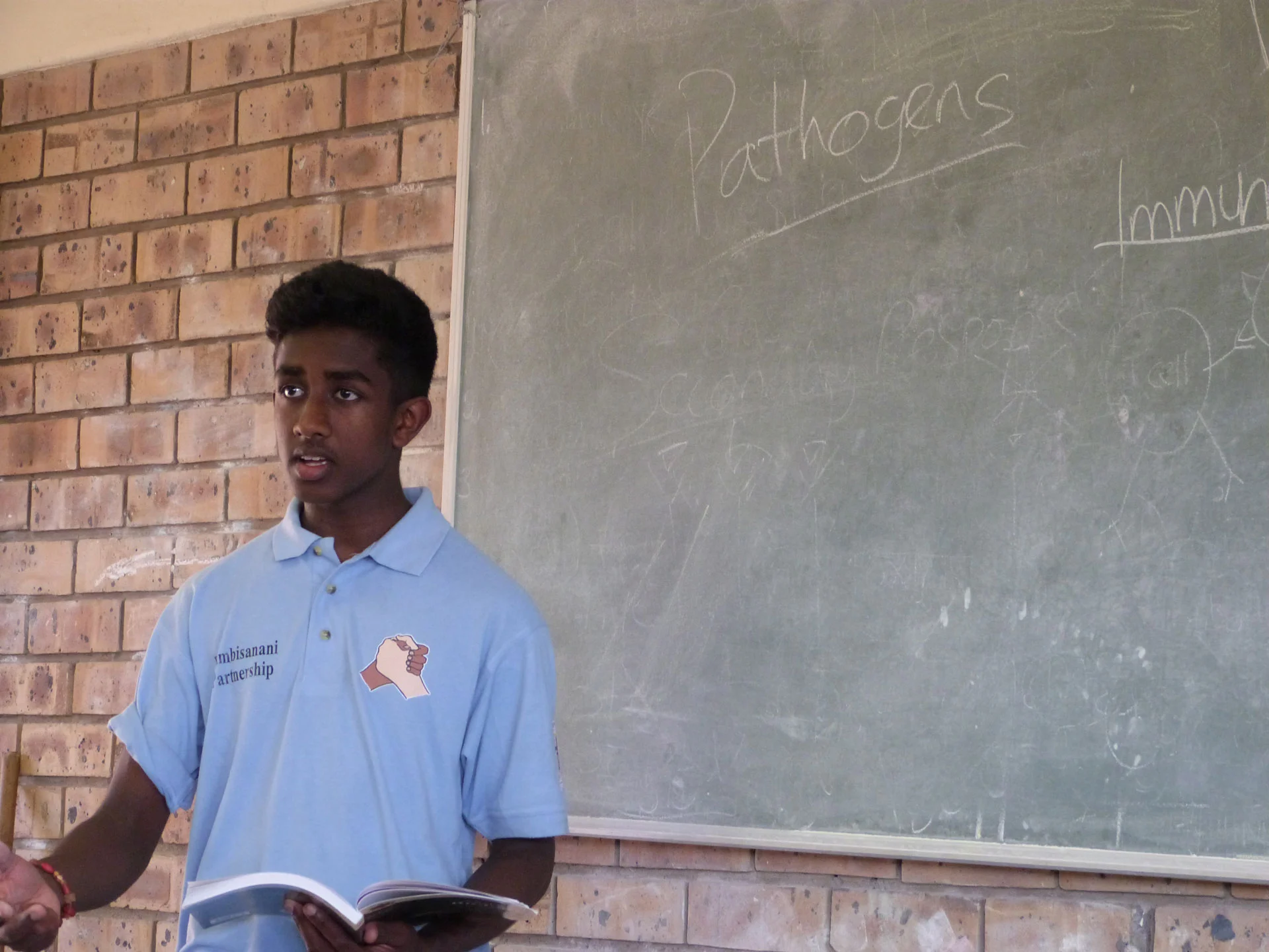 Photo: Kavi teaching science during the 2013 South Africa visit