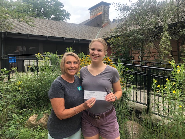 Delivering donation to Severson Dells Nature Center