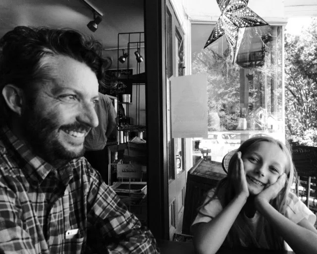 Doug Moe with his daughter in what we will assume is a rare quiet moment.