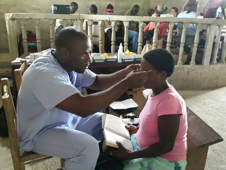 Luckson with patient.jpg
