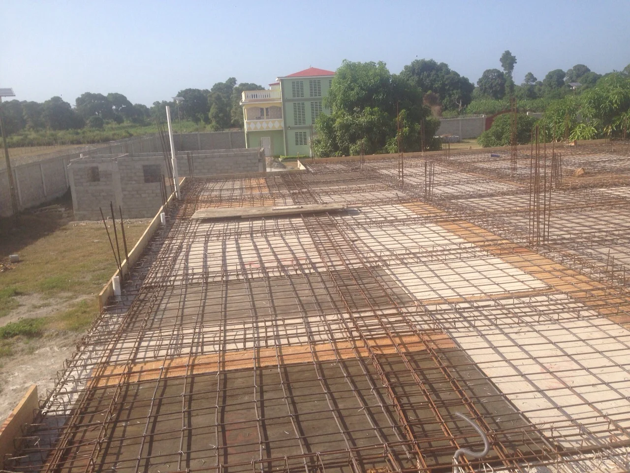 Guesthouse roof with apartment in background