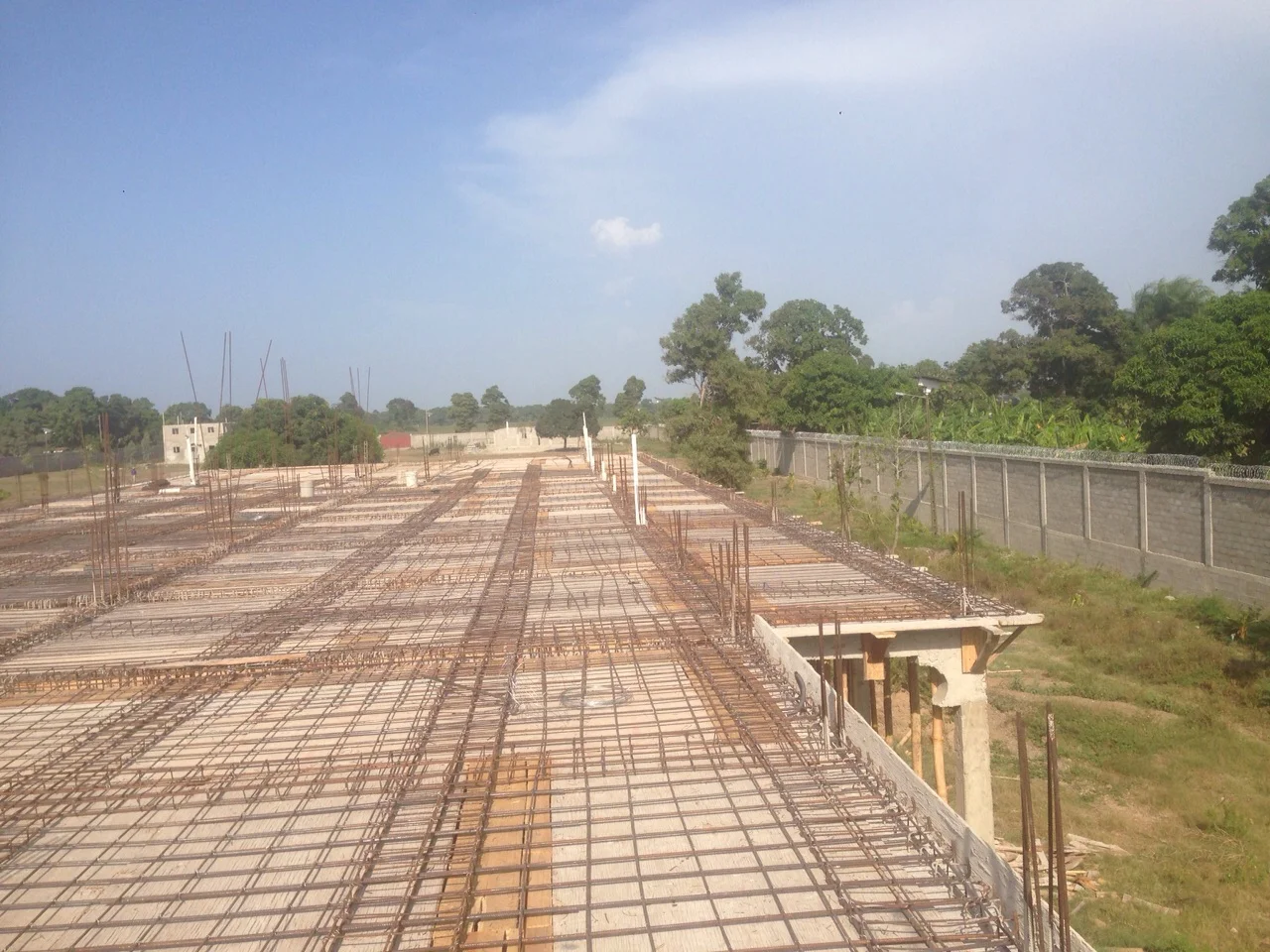 Guesthouse roof with Eye Center and Medical Clinic construction in background
