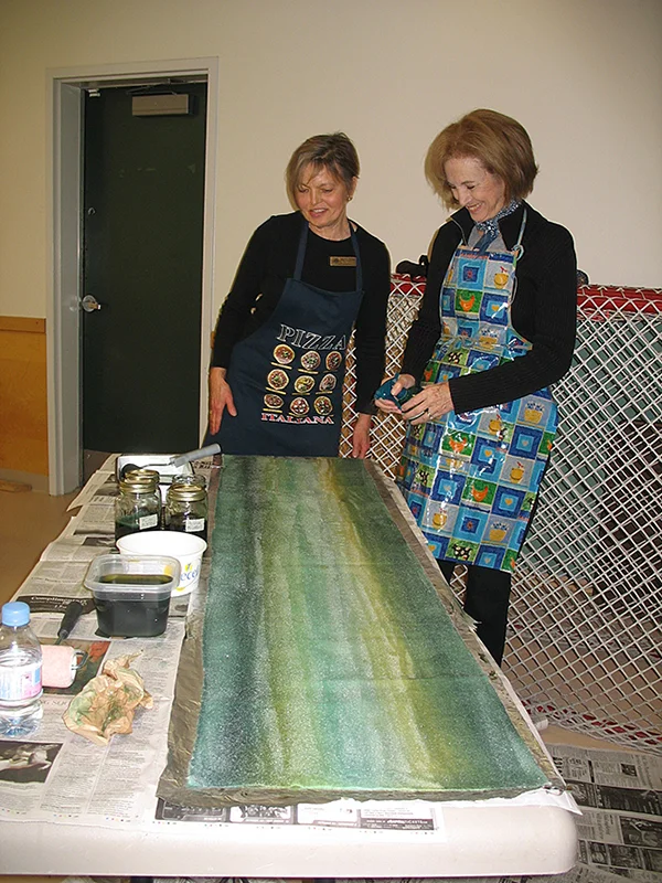 Pam (left) and Stephanie Dyeing material in class
