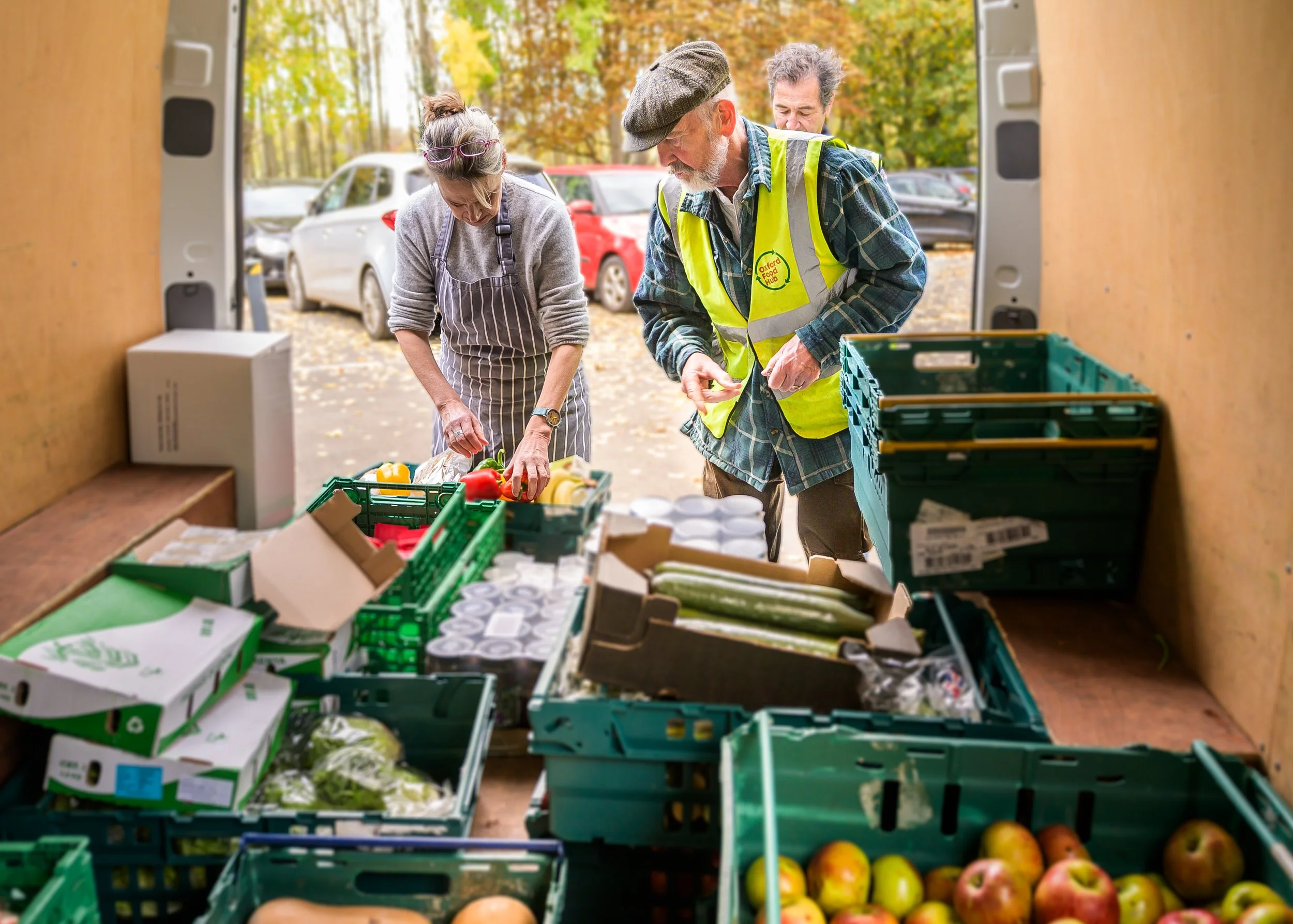 Oxford Food Hub volunteers sorting fresh produce in the delivery van