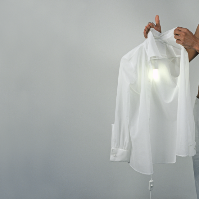 Step 3: Hold the Item Up The material should not be transparent when being held up against a light. If it is, this could be an indicator of careless production or too thin of a yarn, possibly a result of being over-milled. The fabric should appear to be radiant and crisp. Avoid fabrics that appear to shine or are not consistent in color. 