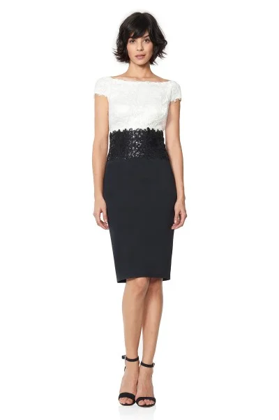 Our Tadashi Iwaki Dress features color-block styling and delicate floral embroidery along the waistline. The shining material draws attention towards the smallest area of an hourglass' figure, slimming the body overall. 